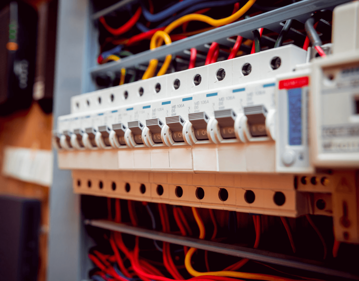 Close-up of a professionally installed electrical breaker panel with neatly routed wiring in Houston